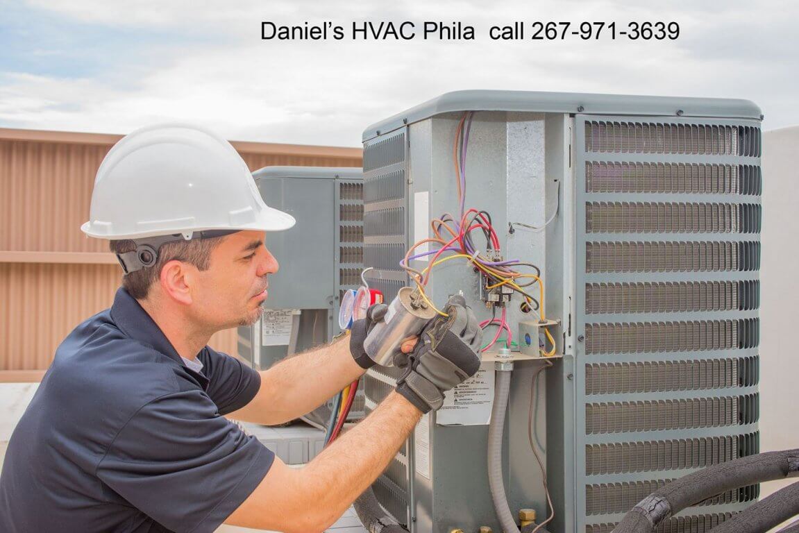 man repairing air condition unit