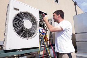 HVAC technician working on a mini-split air conditioning unit