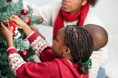 family with the Christmas tree - heater repair service in Philadelphia